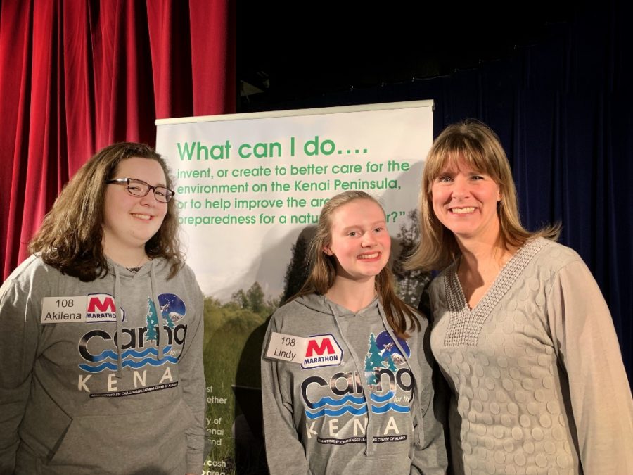 Akilena Veach (left) and Lindy Guernsey (middle) earn 2nd place in the Caring for the Kenai competition.  Jennifer Swander (right) is their writing and speech coach.  George Reising (not pictured) is their science teacher and project coordinator.